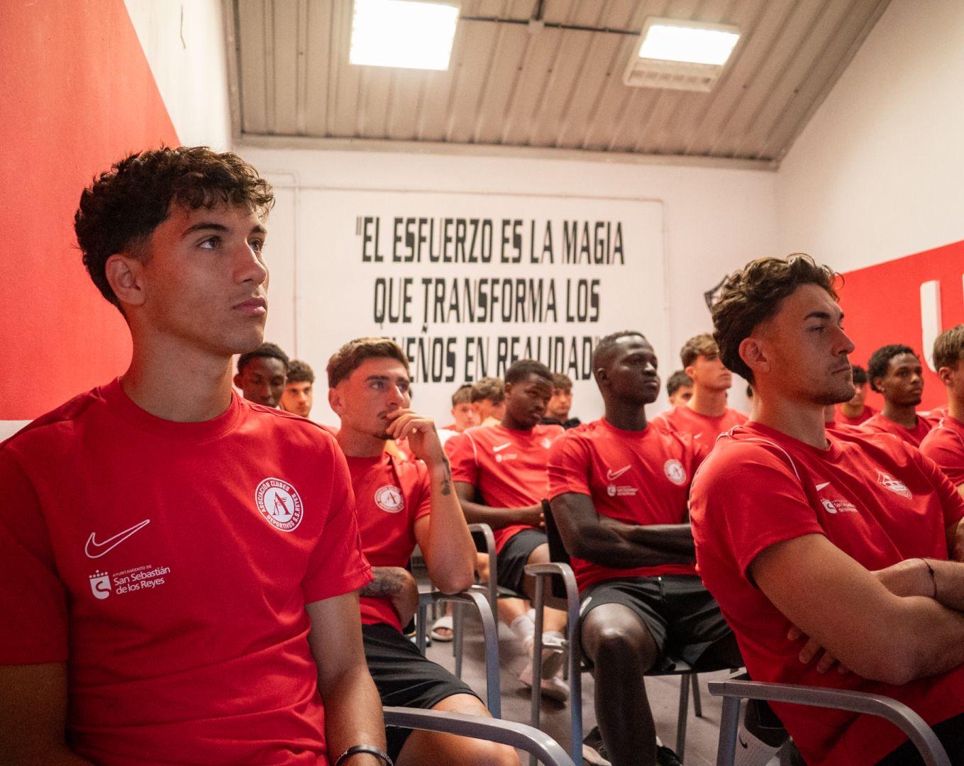 Spanish football coaching staff evaluating players during training